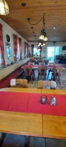 a dining room with a large table and chairs at Zur Turmstube in Dossenheim +50 photos