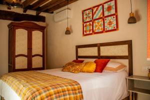 Cama o camas de una habitación en La Casita de los Pájaros