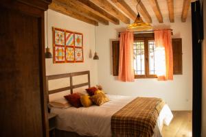 Cama o camas de una habitación en La Casita de los Pájaros