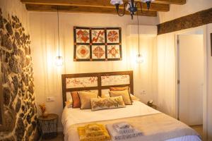 Cama o camas de una habitación en La Casita de los Pájaros