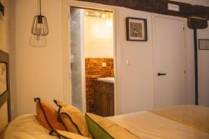 Cama o camas de una habitación en La Casita de los Pájaros