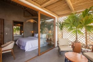 Ein Bett oder Betten in einem Zimmer der Unterkunft Yemanjá Hotel by Preabeach Experience
