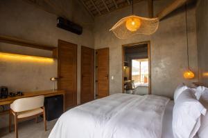 Ein Bett oder Betten in einem Zimmer der Unterkunft Yemanjá Hotel by Preabeach Experience