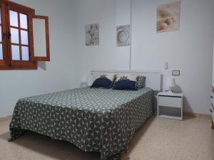 A bed or beds in a room at Casa La Palmera