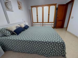 A bed or beds in a room at Casa La Palmera