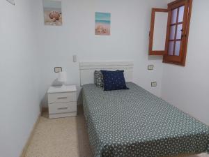 A bed or beds in a room at Casa La Palmera