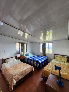 Postel nebo postele na pokoji v ubytování Refugio Natural Lejanías + 32 fotografií