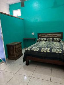 Postel nebo postele na pokoji v ubytování Hotel Libramiento Puerto Vallarta