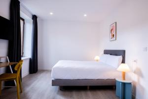 Postel nebo postele na pokoji v ubytování Hotel Gran Vía by gaiarooms