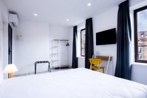 Postel nebo postele na pokoji v ubytování Hotel Gran Vía by gaiarooms