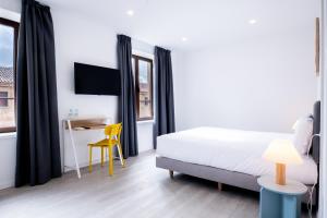 Postel nebo postele na pokoji v ubytování Hotel Gran Vía by gaiarooms