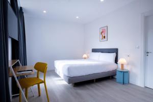 Postel nebo postele na pokoji v ubytování Hotel Gran Vía by gaiarooms