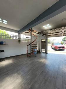 a garage with a car parked in a parking lot at casa en veracruz in Veracruz