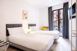 Postel nebo postele na pokoji v ubytování Hotel Gran Vía by gaiarooms