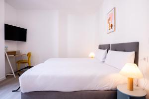 Postel nebo postele na pokoji v ubytování Hotel Gran Vía by gaiarooms