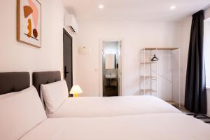 Postel nebo postele na pokoji v ubytování Hotel Gran Vía by gaiarooms