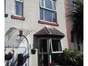 a building with a window and a sign on it at 2 Bodwen Villas in Llangollen