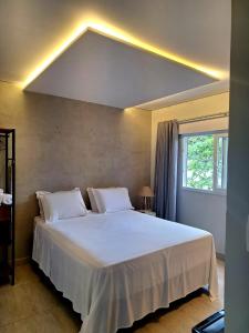 Cama ou camas em um quarto em Casatua Pousada