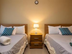 Soficu Hotel El Edén Dominicus客房内的一张或多张床位