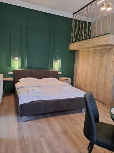 Ένα ή περισσότερα κρεβάτια σε δωμάτιο στο Green Studio