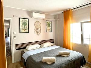 a bedroom with a bed with two pillows on it at Central loft apartments in Santa Pola