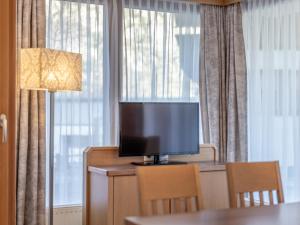 Televízia a/alebo spoločenská miestnosť v ubytovaní Haus Annakogl und Haus Barbara