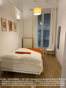 Ένα ή περισσότερα κρεβάτια σε δωμάτιο στο Ramblas Apartments BCN +28 φωτογραφίες