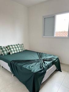 Ένα ή περισσότερα κρεβάτια σε δωμάτιο στο 2 - Casa 5 pessoas - Praia Guilhermina