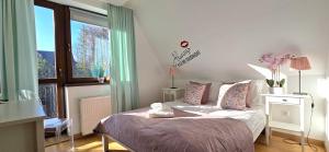 Posteľ alebo postele v izbe v ubytovaní VIP Apartamenty Widokowe