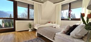 Posteľ alebo postele v izbe v ubytovaní VIP Apartamenty Widokowe