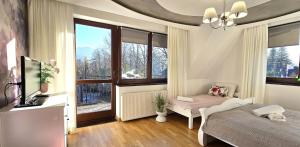Posteľ alebo postele v izbe v ubytovaní VIP Apartamenty Widokowe