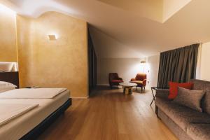 Postel nebo postele na pokoji v ubytování DelleArti Design Hotel