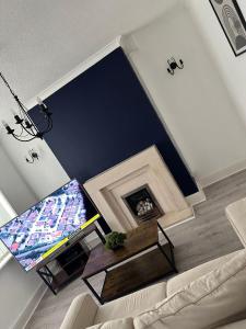 an overhead view of a living room with a fireplace at Abigail house in Westhoughton