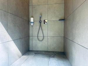 a shower in a bathroom with a shower dstg at ECO River Camp - Pitches in Radovljica