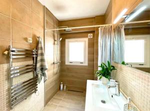 a bathroom with a sink and a mirror at Central loft apartments in Santa Pola +60 photos