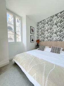 En eller flere senge i et værelse på Studio Vieille Ville - 300m du Lac