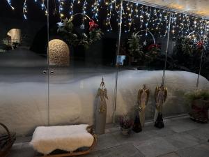 a store window with christmas decorations in a store at Haus am Rain in Partenen