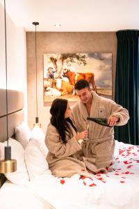 Voodi või voodid majutusasutuse Boutique Hotel Corona toas