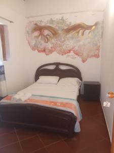 Postel nebo postele na pokoji v ubytování Hostal posada San jose