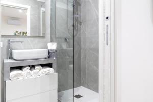 a bathroom with a shower and a sink at La Corte Guest House in Bari +59 photos