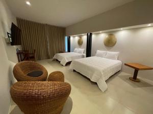 Postel nebo postele na pokoji v ubytování Cuatro Lunas Hotel Boutique