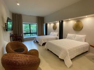 Postel nebo postele na pokoji v ubytování Cuatro Lunas Hotel Boutique