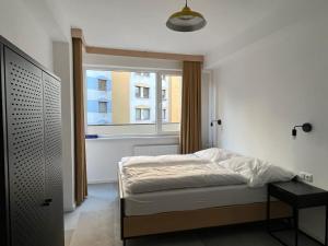 Ένα ή περισσότερα κρεβάτια σε δωμάτιο στο IZY STAY Hostel Bratislava