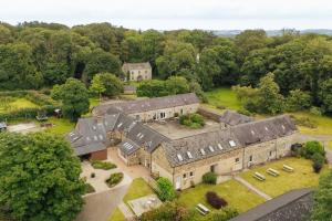 an aerial view of a large house with trees at Coach House Cottage at Scolton - Indoor pool in HAW
