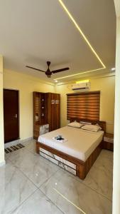 Postel nebo postele na pokoji v ubytování Hawa Residency