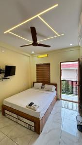 Postel nebo postele na pokoji v ubytování Hawa Residency