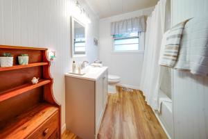 a bathroom with a sink and a toilet and a shower at Mayville Vacation Rental - Walk to Chautauqua Lake in Mayville +17 photos