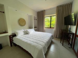 Postel nebo postele na pokoji v ubytování Cuatro Lunas Hotel Boutique