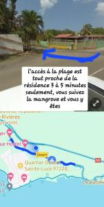 Снимка в галерията на Joli T2 L'Oasis vue mer des Caraïbes proche des plages в Сен-Лу