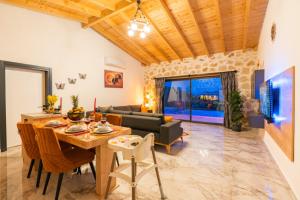 a living room with a table and a couch at Villa estrella in Kaş